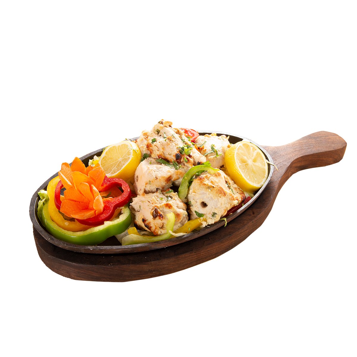 Afghani chicken tikka served sizzling with peppers and lemon